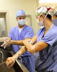 Emory plastic surgeons scrubbing in before the OR.